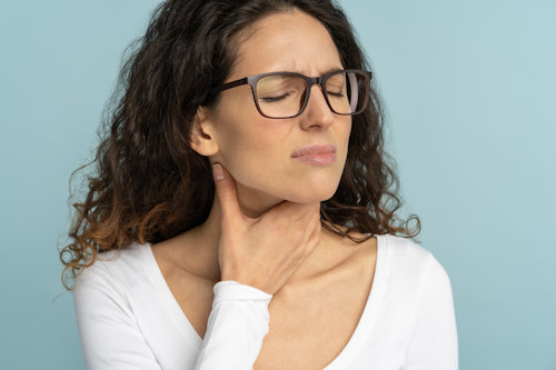 sick-woman-having-sore-throat-tonsillitis-suffer-2022-08-01-04-57-19-utc.jpg