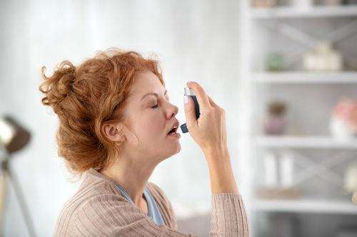 woman-sneezing-while-using-inhalator-because-of-as-2021-09-03-20-25-58-utc-1.jpg