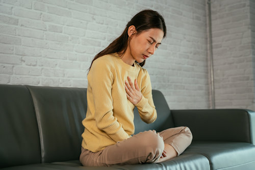 young-female-suffering-from-heartburn-2022-01-27-23-45-49-utc.jpg