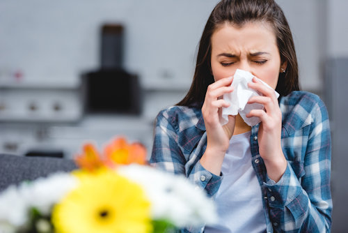 young-woman-with-allergy-holding-facial-tissue-and-2021-08-30-01-45-59-utc.jpg